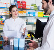 © JackF - apothecary is recommending prescription medicine for man