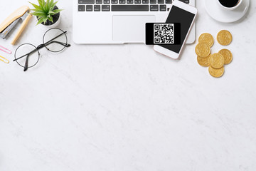 online payment with qr code concept, virtual credit card, smart phone on office laptop desk on clean
