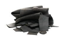 Black Rubber Scraps For Recycling, Isolated On White Background