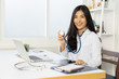 © Have a nice day  - Asian female doctor work at hospital office desk giving patient convenience online service advice, smiling write a prescription order medical with laptop, health care, preventing disease concept.