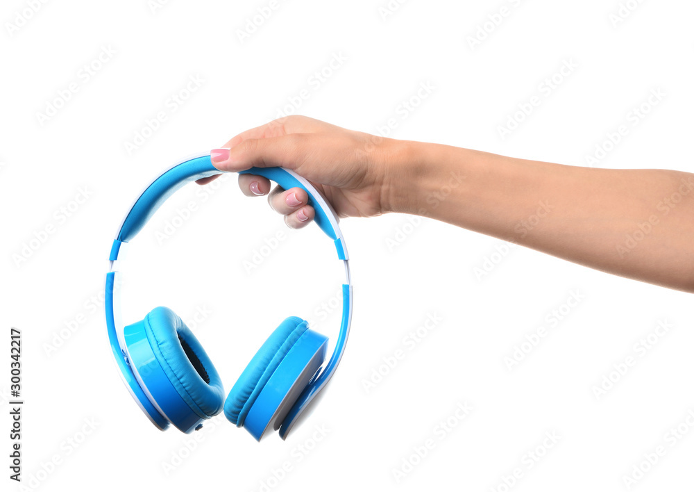 Female hand with headphones on white background