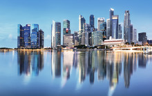 Singapore Skyline At Sunrise - Panorama With Reflection