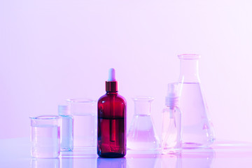 Wall Mural - retro brown bottle with flask in science laboratory background