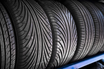  Close up new tyres on shelve in tire shop