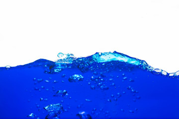 Close up blue Water splash with bubbles on white background