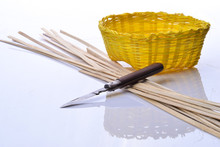 Put A Knife On Bamboo Line With Yellow Basket On White Acrylic Sheet Stock Photo