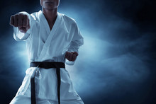 Karate Martial Arts Fighter On Dark Background