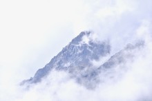 Jade Dragon Snow Mountain On Foggy Morning In Lijiang, Yunnan