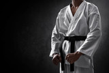 Karate martial arts fighter on dark background