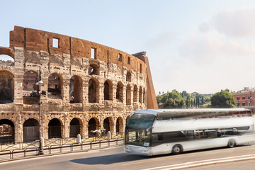 Touristy travel white bus Rome Colosseum sunny morning