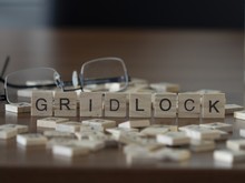 The Concept Of Gridlock Represented By Wooden Letter Tiles