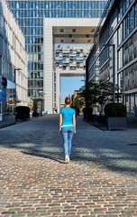 Wall Mural - Tourist in Cologne near Kranhaus building complex with crane house on riverside of Rhein in Cologne, Germany.