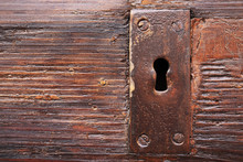 Lock Keyhole On Old Wooden Door