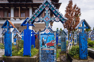 Sticker - Merry Cemetery in Sapanta village, famous for its painted headstones, one of the major tourist attractions in Romania