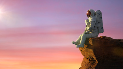 Wall Mural - astronaut on planet mars, sitting on a cliff