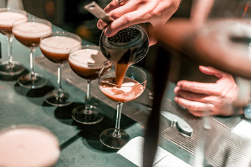 Wall Mural - Bartender making cocktails at the bar, alcoholic drinks  