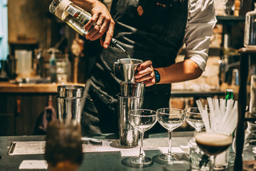 Wall Mural - Bartender making cocktails at the bar, alcoholic drinks  