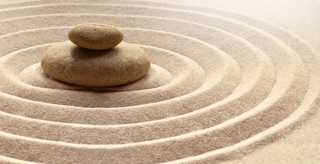 zen garden meditation stone background with stones and lines in sand for relaxation balance and harm