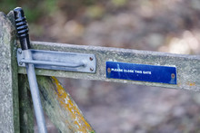 Please Close Gate With Lifting Handle And Latch Sign On Walking Rambling Route In Countryside Uk