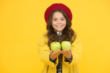 Get Vitamin Start To School Year. Happy Girl Hold Vitamin Fruit Yellow Background. Little Child Smile With Green Apples. Healthy Vitamin Snack. School Health. Best Vitamin Sources