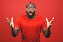 Portrait Of Excited Young African American Male Screaming In Shock And Amazement. Surprised Black Hipster Looking Impressed, Can't Believe His Own Luck And Success.