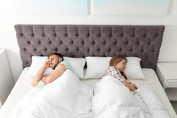 Wall Mural - Young couple with relationship problems in bed at home