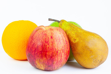 VARIOUS FRUIT, APPLES, ORANGE AND PEAR ON WHITE BACKGROUND. AUTUMN FRUIT