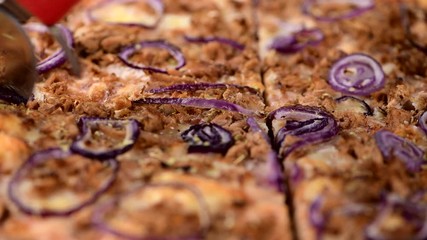 Wall Mural - Slicing up a Pizza in detailed 4K (close-up footage)