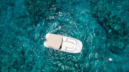 Empty Deck Boat anchored on Molasses reef in Florida Keys