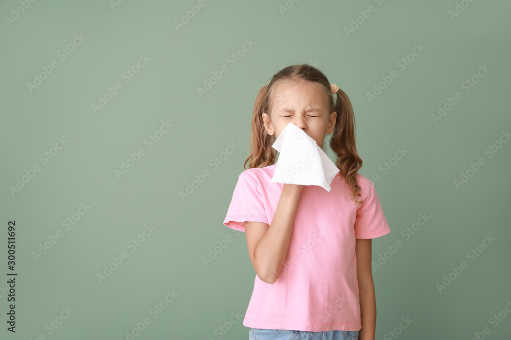 Little girl suffering from allergy on color background