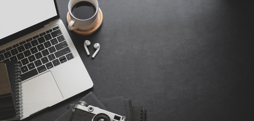 Canvas Print - close-up view of dark modern workplace with laptop computer and office supplies