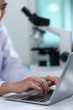 © chokniti - using laptop for working in laboratory