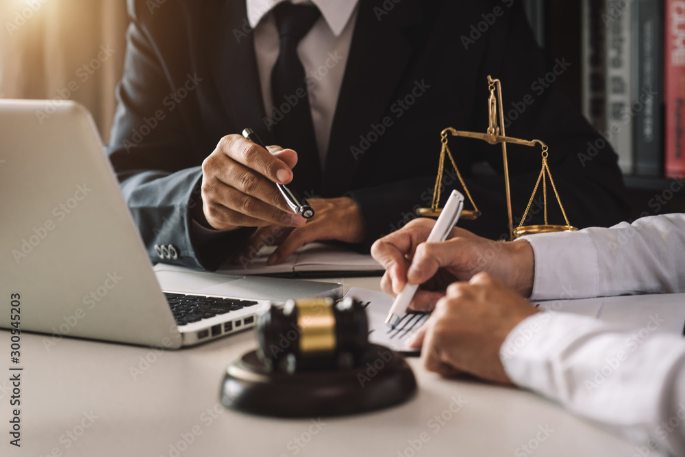 business people and lawyers discussing contract papers sitting at the table. Concepts of law, advice, legal services. in morning light - obrazy, fototapety, plakaty 