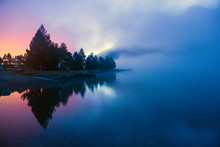 Fog Over A Mountain Lake Before Dawn.