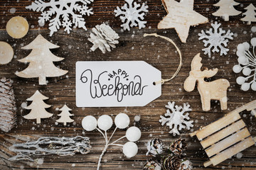 One White Label With English Text Happy Weekend. Frame Of Christmas Decoration Like Tree, Sled, Star And Fir Cone. Wooden Background With Snowflakes