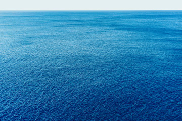 blue sea surface with waves aerial view