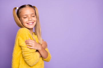 Sticker - Photo of trendy cheerful toothy beaming girl hugging herself feeling comfortable isolated pastel violet color background