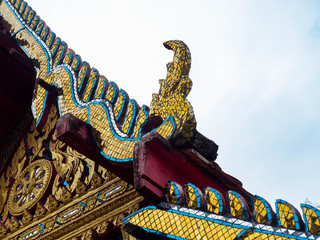 Wall Mural - Beautiful old roof is texture colors Gold,Designed by Thai people,Temple name is Wat kaew at Bangkok Thailand