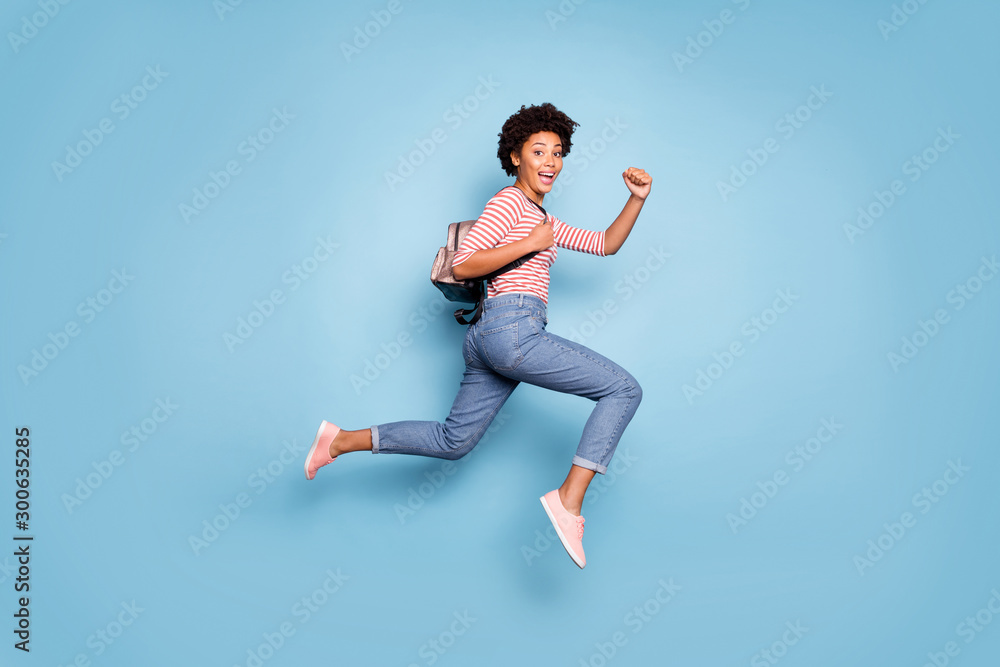 Full length photo of cheerful funny teenage afro american girl jump run ...
