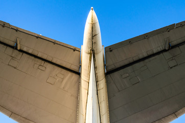 Wall Mural - wings of a large airliner on a blue background