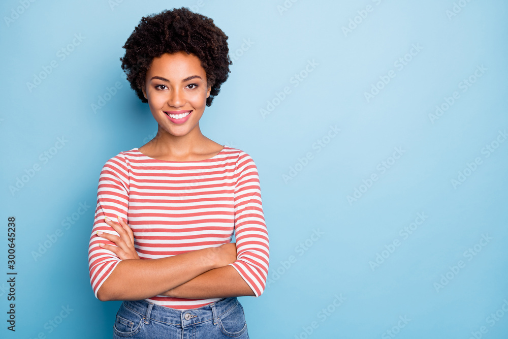 Photo of cheerful toothy beaming positive girlfriend with arms crossed near empty space wearing jeans denim isolated over blue pastel color background - obrazy, fototapety, plakaty 