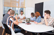 © studiomay - A group of people at a business training listens to the speaker or chief. Teamwork in an international company, students