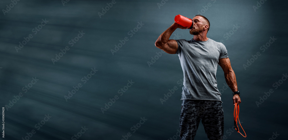 Nutritional Supplement. Muscular Men Drinks Protein, Energy Drink After Workout - obrazy, fototapety, plakaty 