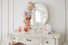 Vintage Style Boudoir Table With Round Mirror And Flowers. White Bright Room.