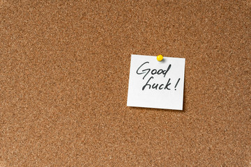 Wall Mural - Good luck! Handwritten inspirational supportive lettering on a sticker on a cork board. Background and texture.