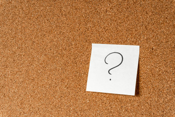 Wall Mural - Question mark on sticker on cork board, Background, copy space.