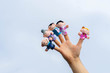 family finger puppet theater. child hand with finger puppets: son, daughter,mum, dad, granny, granddad. Kid playing fingers puppets. Family and generation concept. social distancing. end quarantine.
