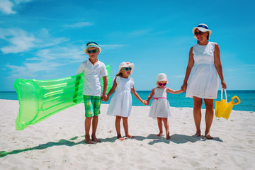 Wall Mural - mother with kids-son and daughters- go to the beach