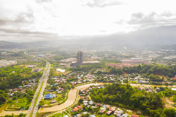 Poster - Aerial drone image of beautiful rural town local lifestyle houses residential of Menggatal Town, Sabah, Malaysia