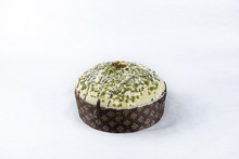 Panettone With Pistachio Icing - Typical Italian Christmas Cake Made With Eggs, Butter And Pistachios